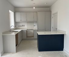 New kitchen. Never used. Grey. With peninsula.