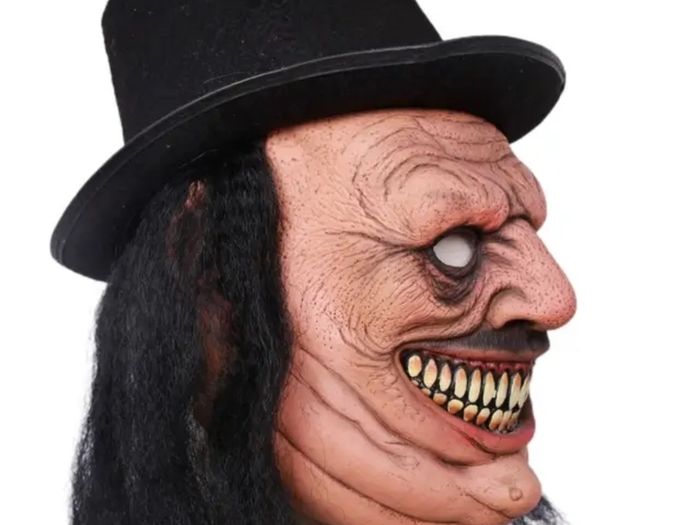 Zombie latex Halloween mask with hat and hair.