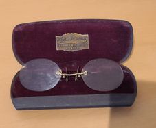 Very collectable vintage clip on glasses from Nora Mooney optician's