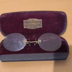 Very collectable vintage clip on glasses from Nora Mooney optician's