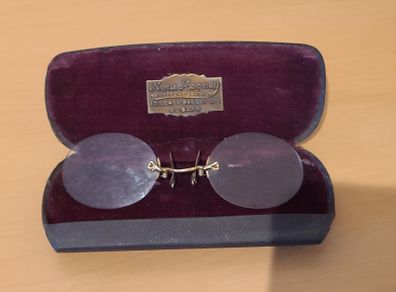 Very collectable vintage clip on glasses from Nora Mooney optician's