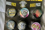 Wrestling autographs on badge set
