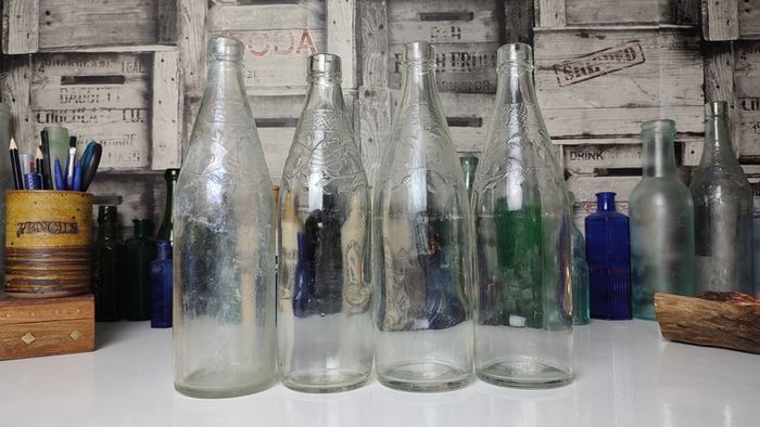 301 - Set of 4 Vintage Floral Decorative Collectible Clear Glass Tall Big Bottles