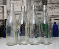 301 - Set of 4 Vintage Floral Decorative Collectible Clear Glass Tall Big Bottles