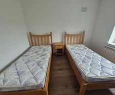 2x Solid Oak Single Beds incl mattress and bedside locker.