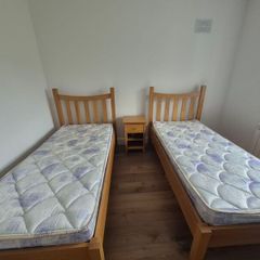 2x Solid Oak Single Beds incl mattress and bedside locker.