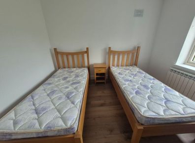 2x Solid Oak Single Beds incl mattress and bedside locker.