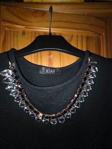 black dress with necklace