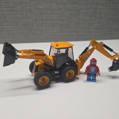 Siku die-cast model of a JCB 4CX backhoe loader.