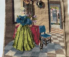 Vintage Penelope / Needlepoint Tapestry Design No. 3922) depicting a interior genre scene of a woman in a blue bodice and yellow skirt arranging flowers by a table.
