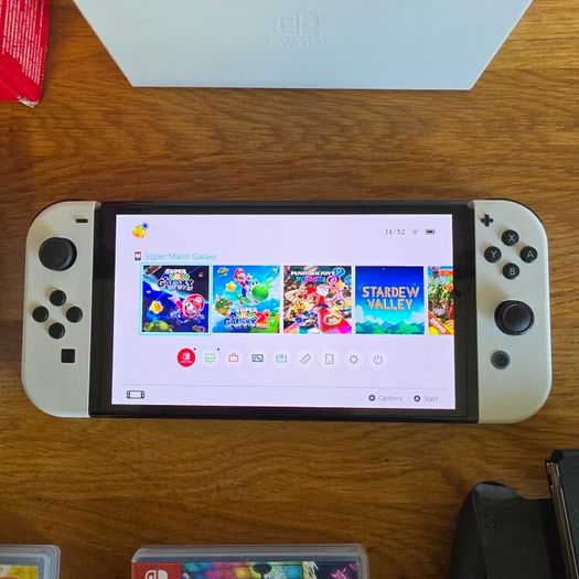 Nintendo Switch OLED (plus 3 games and travel case)