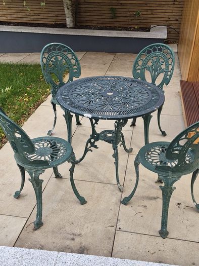Cast metal garden table and four chairs