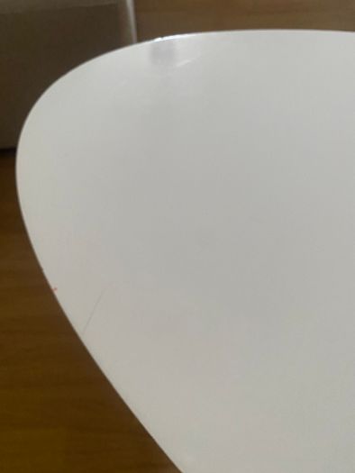 Oval white coffee table with wooden legs
