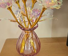 6 small roses in pink vase