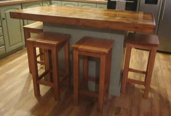 Rustic kitchen island with triple overhang