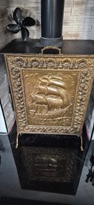 Vintage brass fireplace screen with ship design
