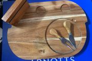 wooden cheese platter with fork and knife