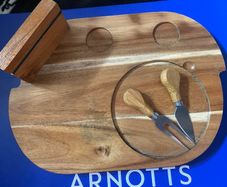 wooden cheese platter with fork and knife