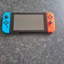 Nintendo switch with games and accessories Image 2