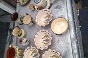 A Lot of Longpark Torquay pottery including a teapot featuring a brown glazed lid and spout.It is a "mottoware" piece from England, dated between 1905 and 1923,