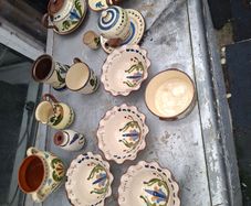 A Lot of Longpark Torquay pottery including a teapot featuring a brown glazed lid and spout.It is a "mottoware" piece from England, dated between 1905 and 1923,