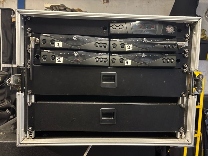 AKG radio microphone system:  4 x AKG HT 470 D Band 10 microphones with 4 x AKG SR470