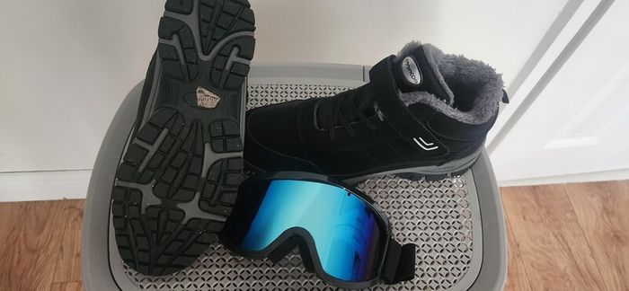 Men ski boots and glasses
