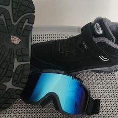 Men ski boots and glasses