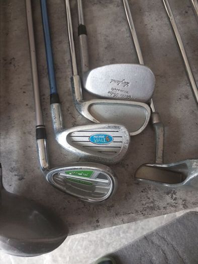 A selection of junior golf clubs and bag.