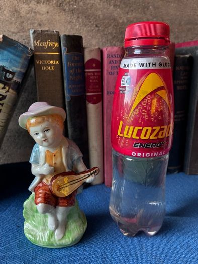 Vintage ceramic figurine of a young Boy Playing a Mandolin