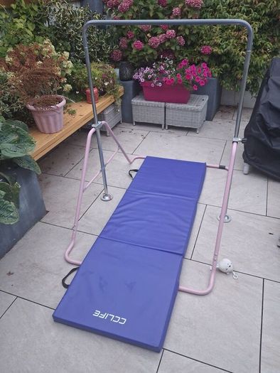 Kids gymnastics bar and folding mat