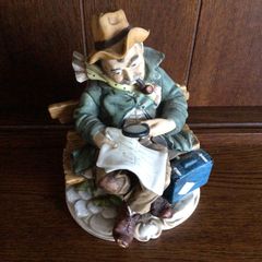 Capodimonte Style Man on Bench Ornament