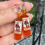 Mini Spiced Rum Bottle Drop Earrings. Image 2