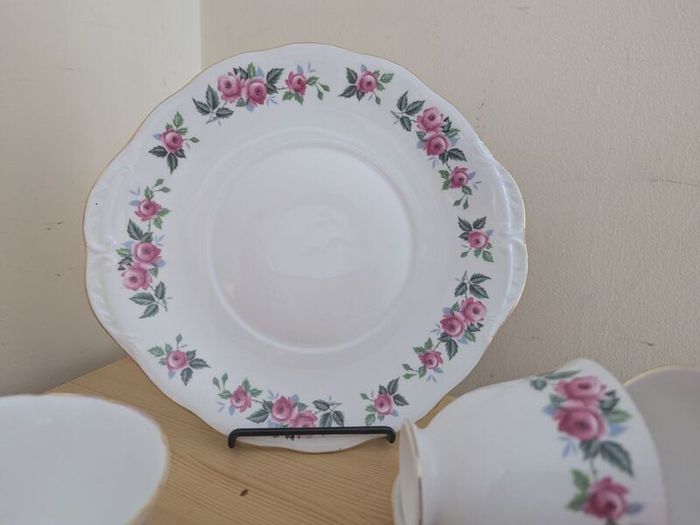 Queen Anne Bone China, tea set for 4 person, contains 11 pcs, including 4 tea cups, 4 saucers, a milk jar, a sugar bowl and a cookie serving plate 22cm. Impeccable conditions, looks like a new one, any scratches, cracks or cips.