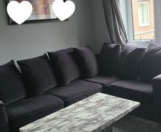4-seater black corner sofa