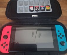 Nintendo switch + 4 games and case