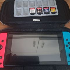 Nintendo switch + 4 games and case