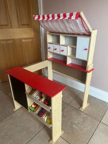 Children's wooden kitchen with chalk board