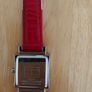 Tommy Hilfiger watch features a distinctive rectangular stainless steel case and a reversible red, white, and blue leather strap Image 4