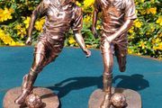 Two Gilded footballers