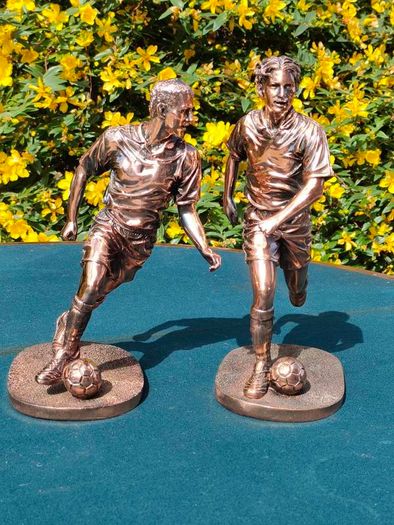 Two Gilded footballers