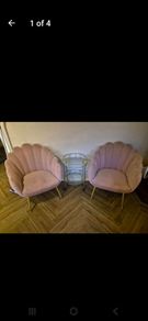 Two pink velvet shell chairs