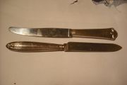 2 antique silver handled butter knifes