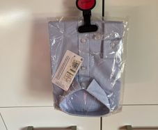Next light blue long sleeve shirt. Brand new. Age 8-9