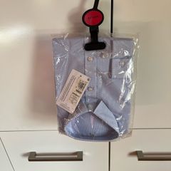 Next light blue long sleeve shirt. Brand new. Age 8-9