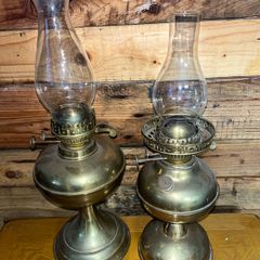 Two antique brass oils lamps