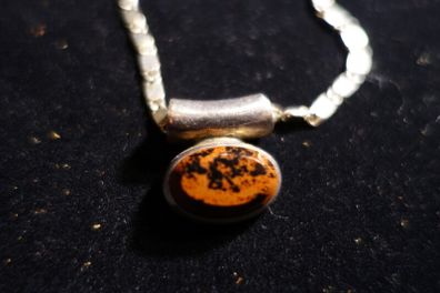 Tiger eye style stone in silver set with large linked silver chain