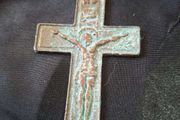 A Rare Victorian Bronze Crucifix Underneath Christs feet, there is an arched shape with a round object inside. This represents the Skull of Adam