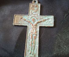 A Rare Victorian Bronze Crucifix Underneath Christs feet, there is an arched shape with a round object inside. This represents the Skull of Adam