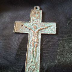 A Rare Victorian Bronze Crucifix Underneath Christs feet, there is an arched shape with a round object inside. This represents the Skull of Adam